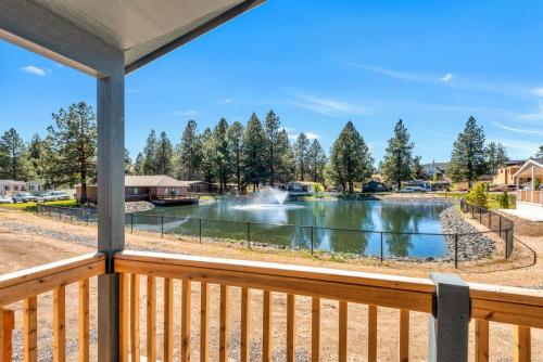 A view of a pond from the deck of a home.